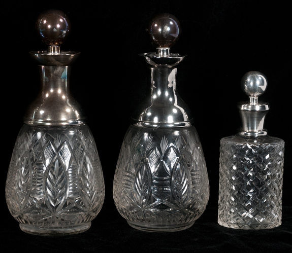 Collection of Six Cut Crystal Decanters with Silver Plated Mounts
