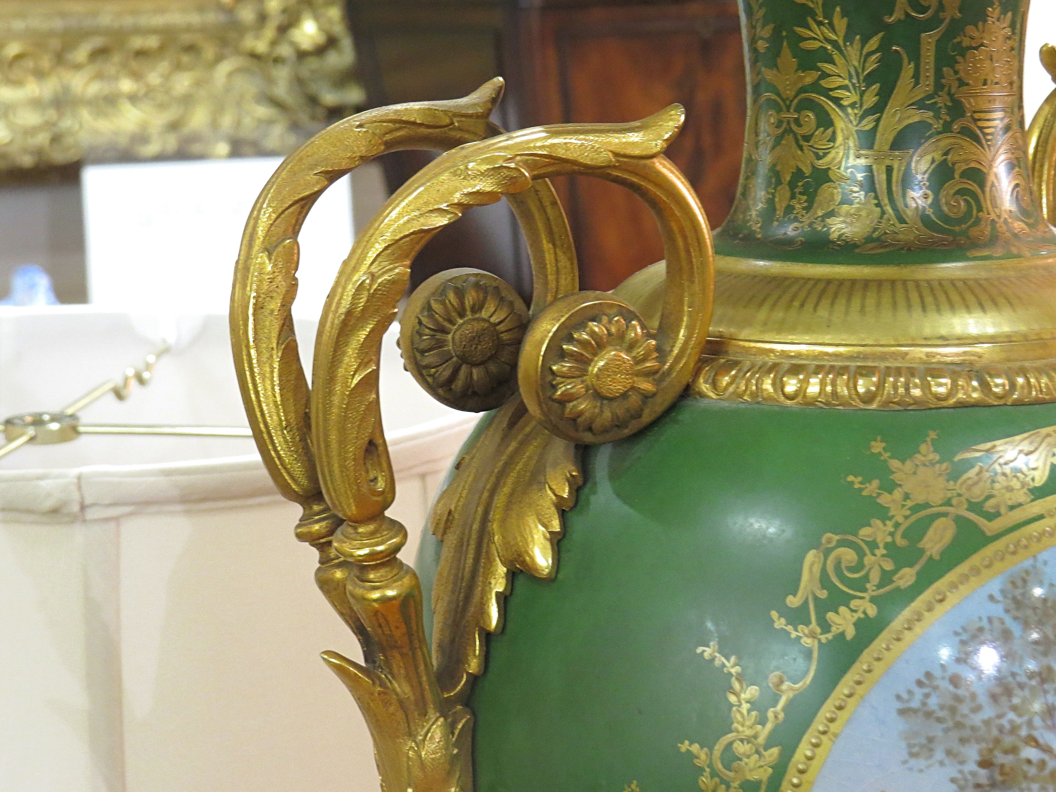 Pair Of Bronze Mounted Sevres Porcelain Urns Adapted As Lamps.