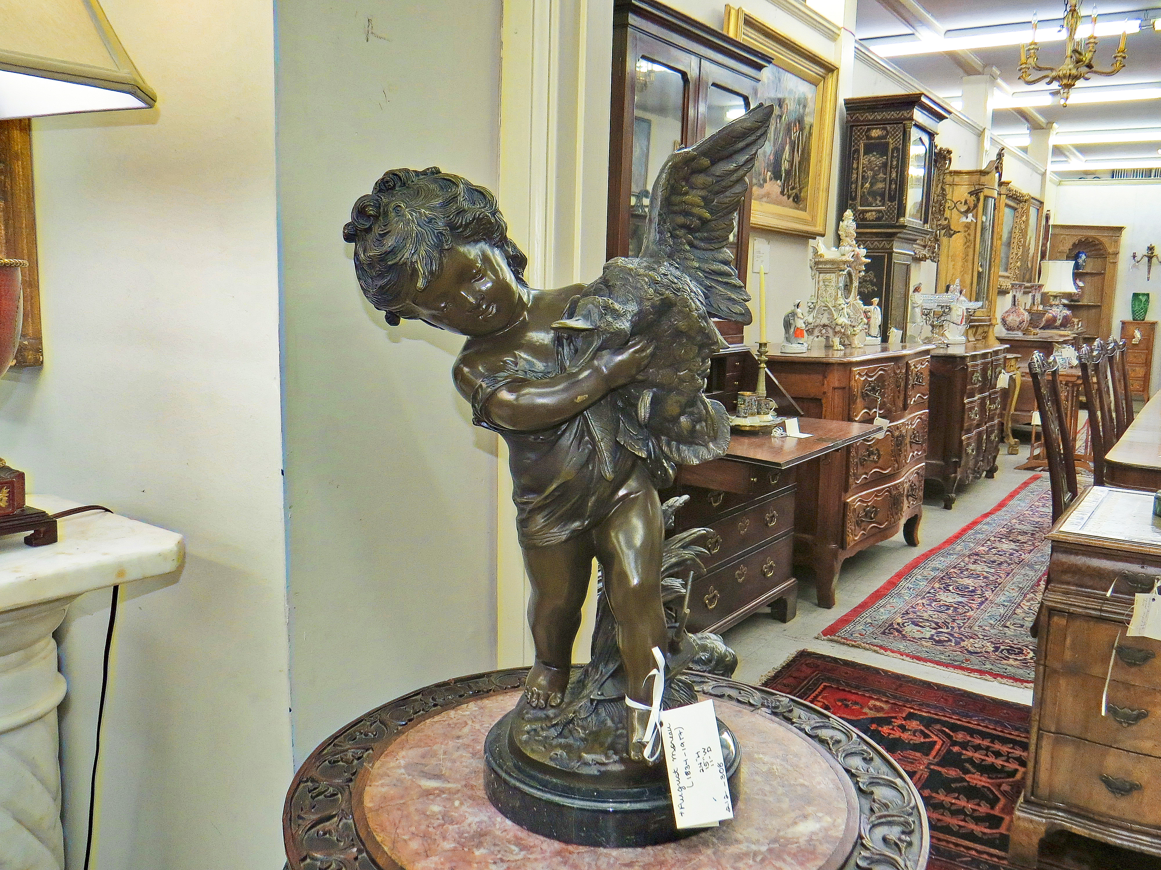 French Bronze of a Child holding a Goose; Signed August Moreau
