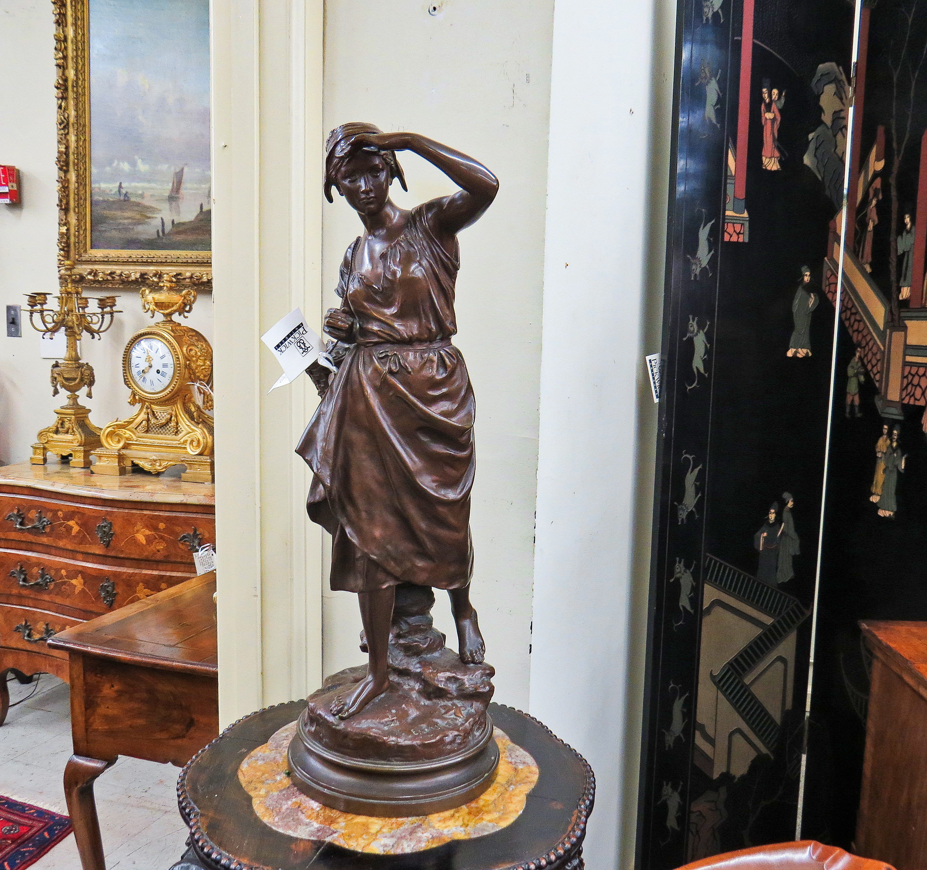 French Bronze Sculpture of a Female Figure with a Basket; Signed E. Laurent (1832-1898)