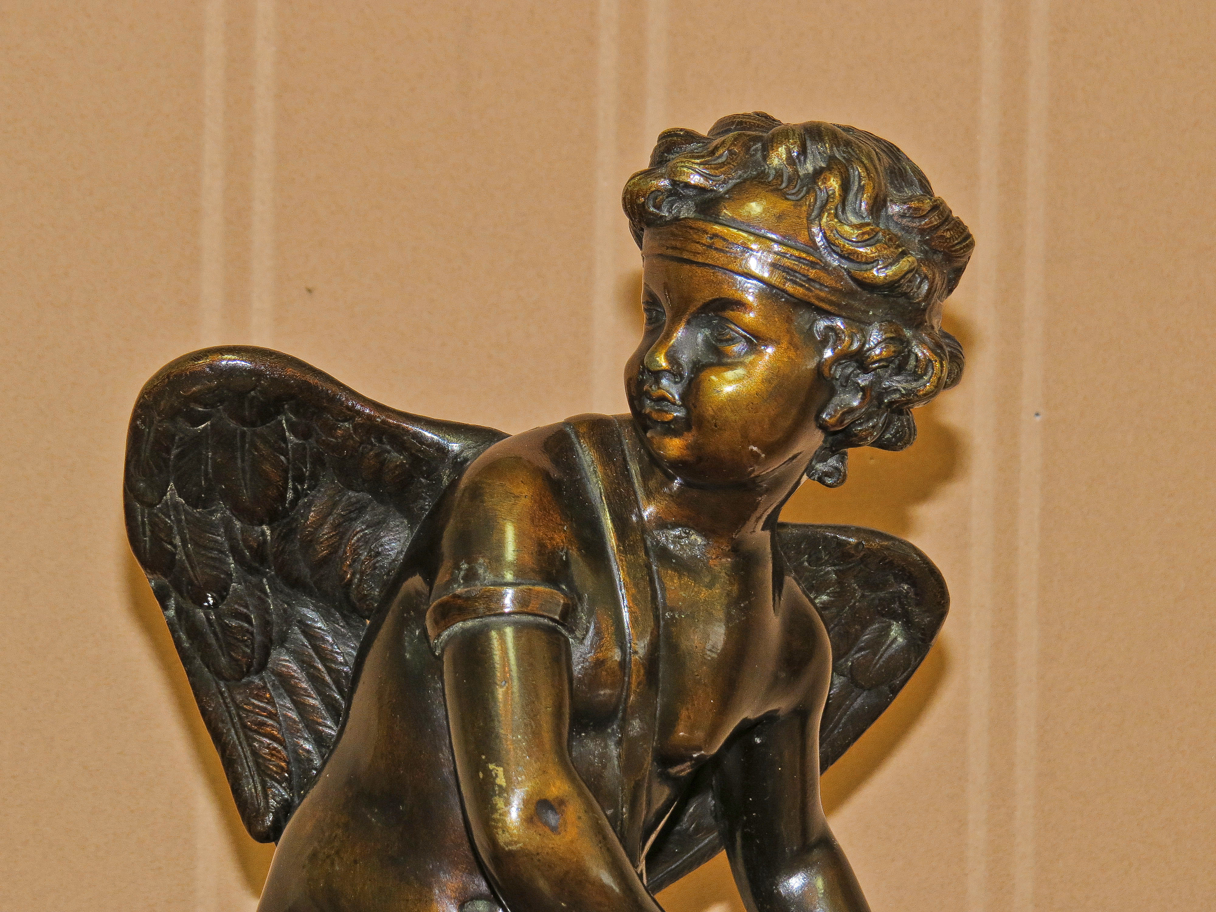 Pair of French Bronze Sculptures of a Male Figure and a Cherub