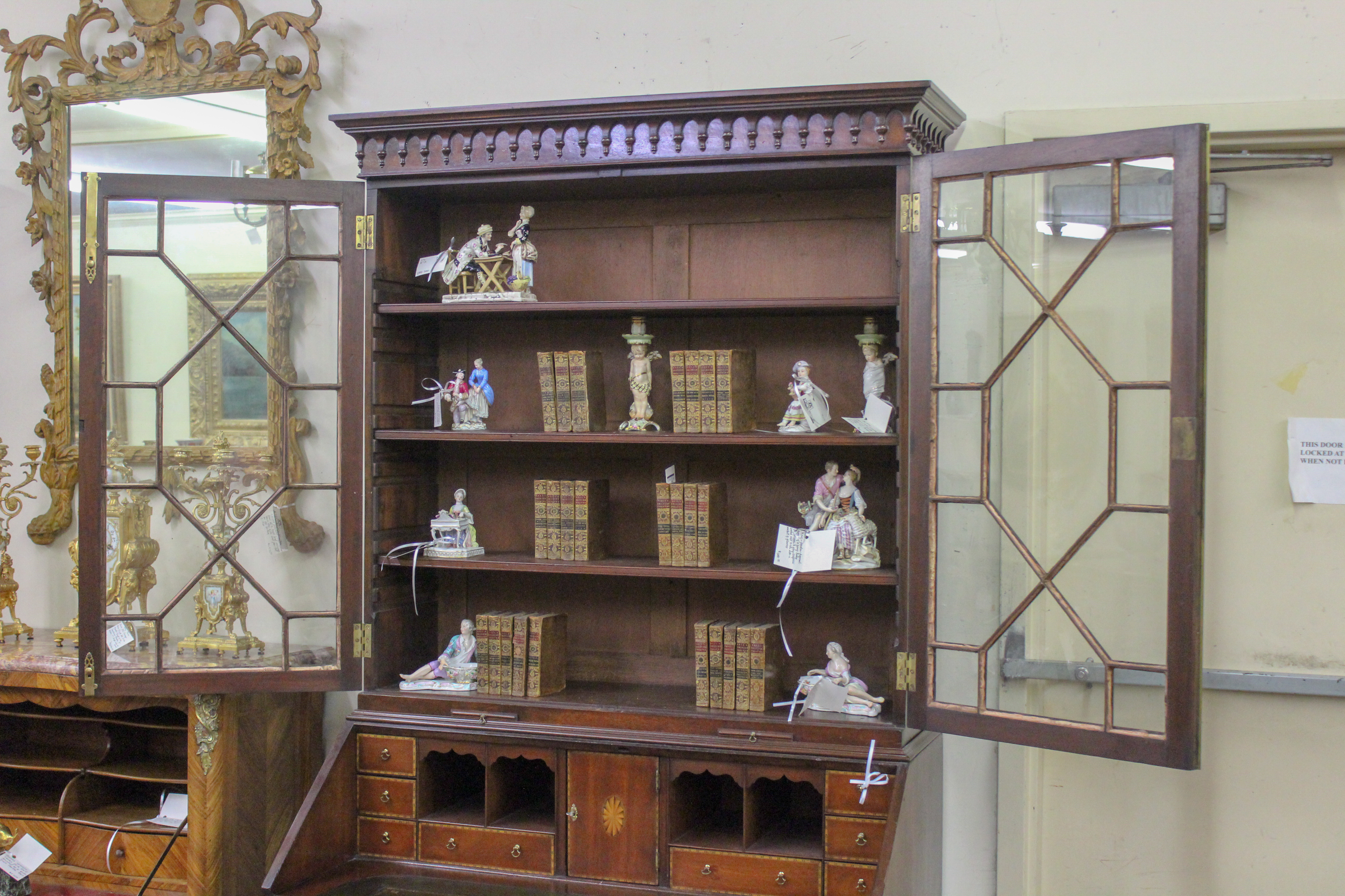An English Chippendale Mahogany Bureau Bookcase with Tear Drop Crown Molding